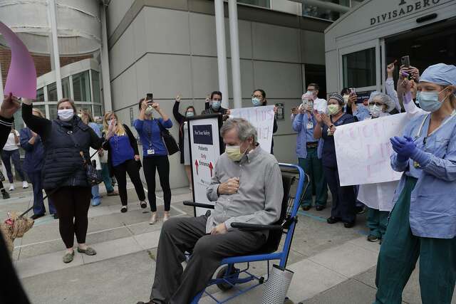 Ron Temko is cheered as he leaves the hospital after cheating death from the coronavirus.
