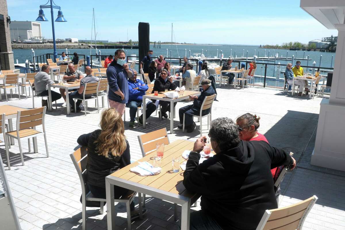 The deck at Boca Oyster Bar was open for customer, overlooking Bridgeport Harbor in Bridgeport, Conn. May 20, 2020.