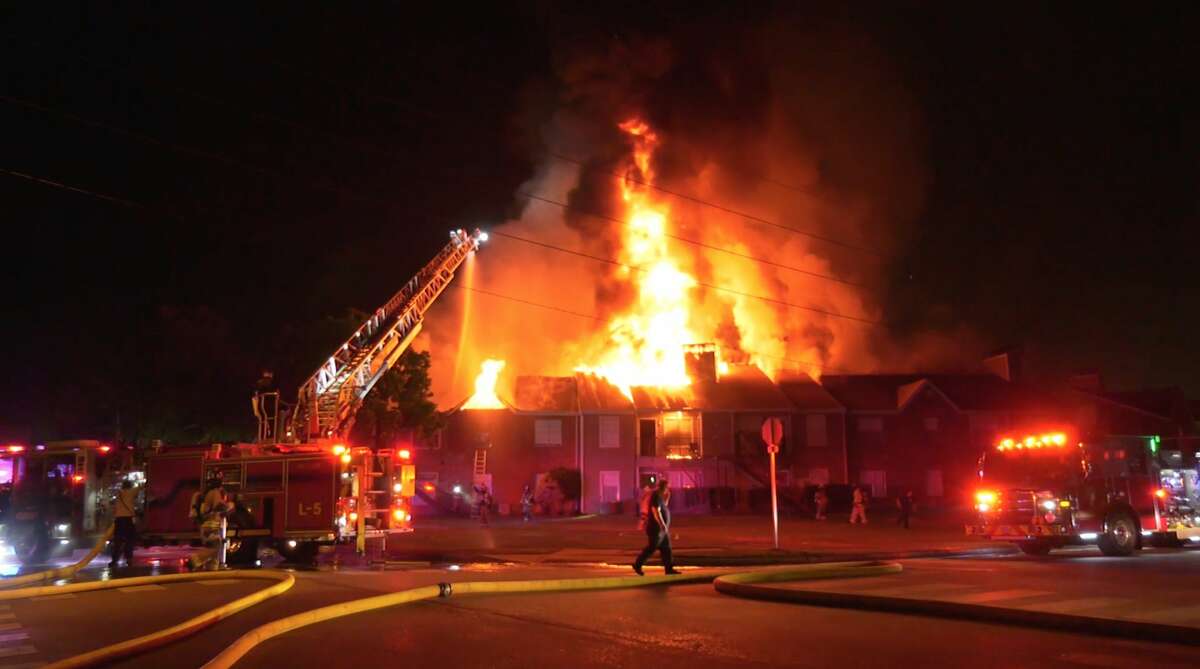 Tomball firefighters battle a massive apartment fire at 920 Lawrence Street on Thursday, May 21, 2020.