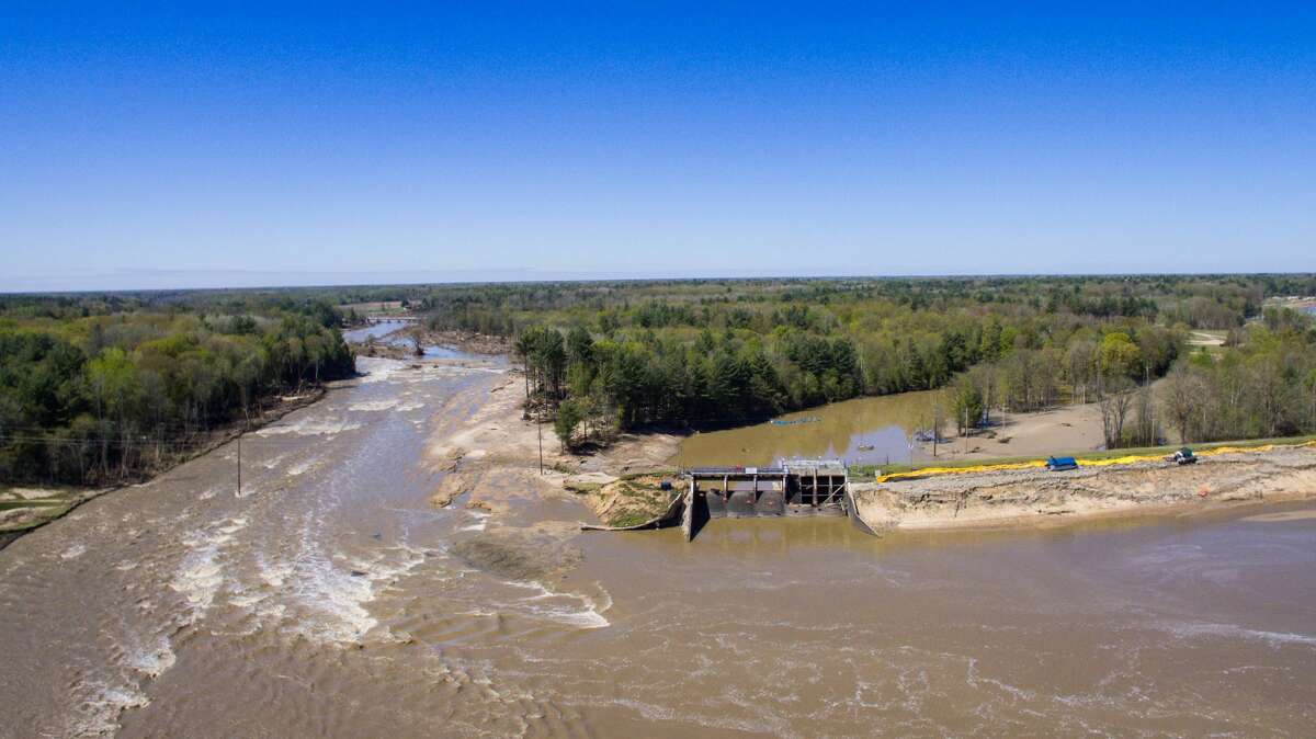 An aerial photo taken Thursday, May 21, 2020 shows the aftermath of record flooding following the breach of the Edenville Dam and failure of the Sanford Dam in Midland County. The Tittabwassee River reached a record 35.05 feet in Midland on Wednesday, May 20.