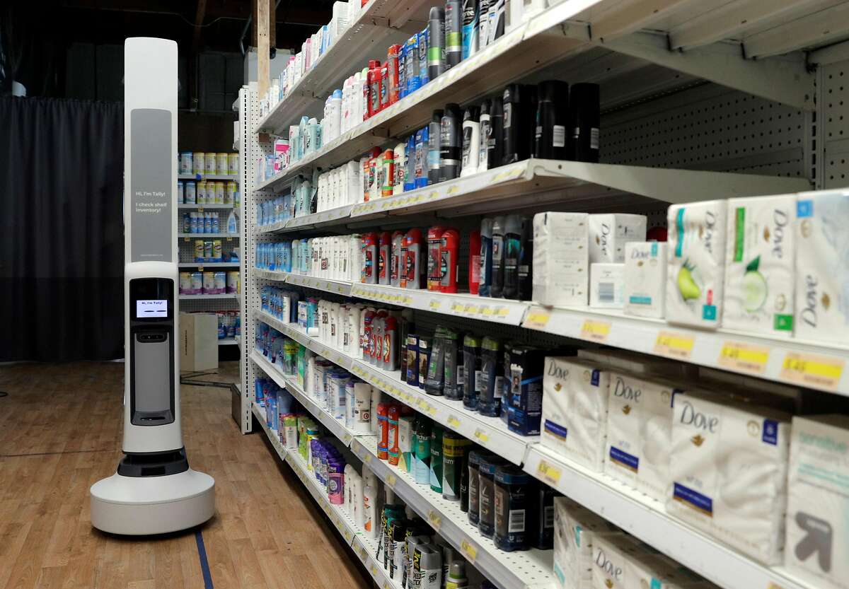 Tally, a robot for inventory management created by Simbe, rolls by a store shelf setup to scan items with photo and LIDAR as it counts items at the company's headquarters in South San Francisco, Calif., on Tuesday, May 12, 2020. Tally, the robot scans stocked store shelves for products using cameras, LIDAR, and RFID to take a count of inventory.