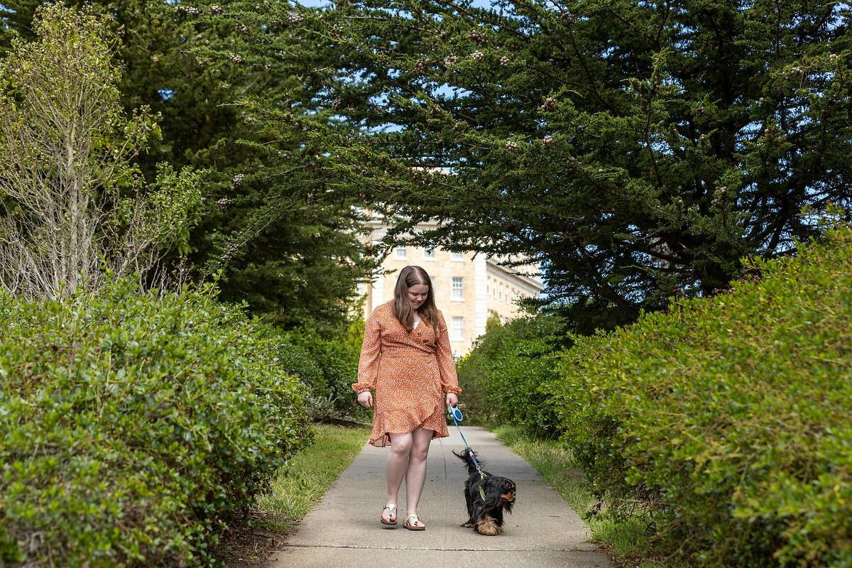 Kathryn Booth walks with her dog, Matilda, near her home in the Inner Richmond District.