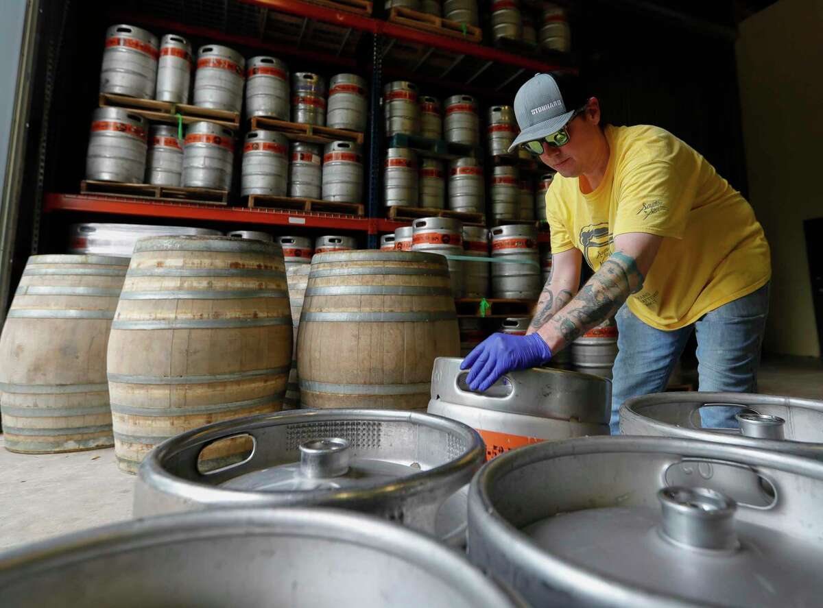 Bill Ferguson rolls a keg freshly filled with beer at B-52 Brewing ahead of Friday’s reopening Wednesday, April 20, 2020, in Conroe. The brewery reopens to customers Friday with social distancing and other guidelines under Gov. Greg Abbott’s phased reopening of the economy.