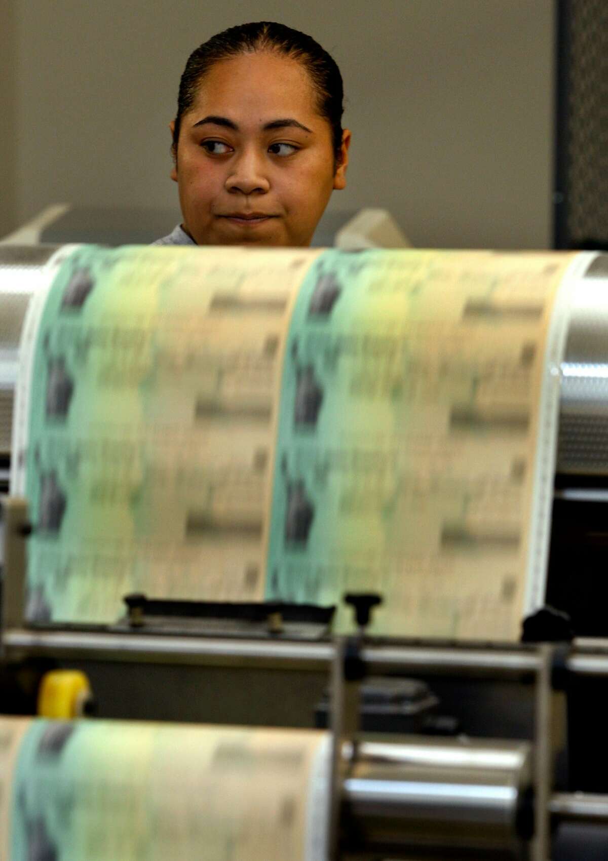 Elitisi Fanaika monitors the progress of economic stimulus checks that are printed at a Treasury Department facility in Emeryville, Calif., on Thursday, May 7, 2009. Social Security recipients are among the millions who will receive the $250 stimulus checks.