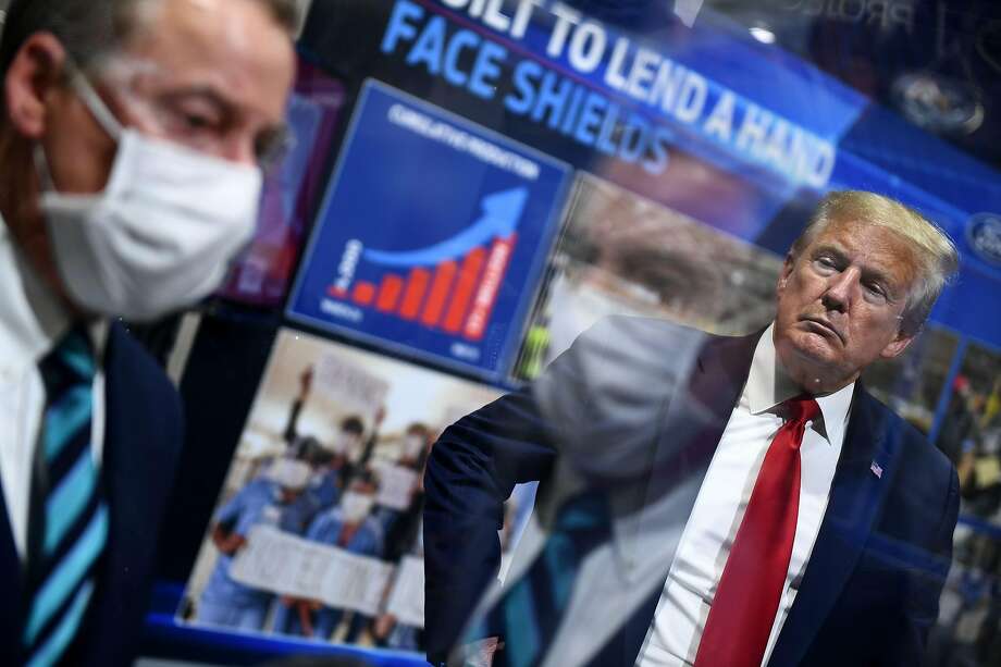 Pandemic politics: Maskless Trump tours Michigan Ford plant ...