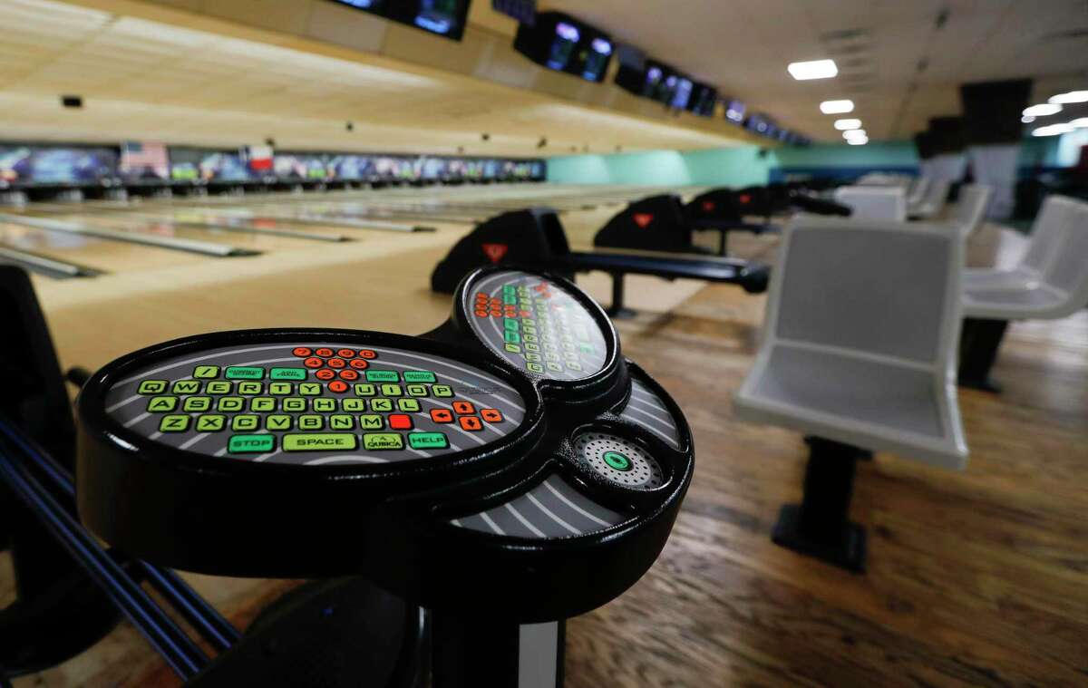 Control panners will we wiped down after every customer finishes a game of bowling at 300 Bowl, Thursday, May 21, 2020, in Conroe. The business reopens to customers Friday with social distancing and other guidelines under Gov. Greg Abbott’s phased reopening of the economy.