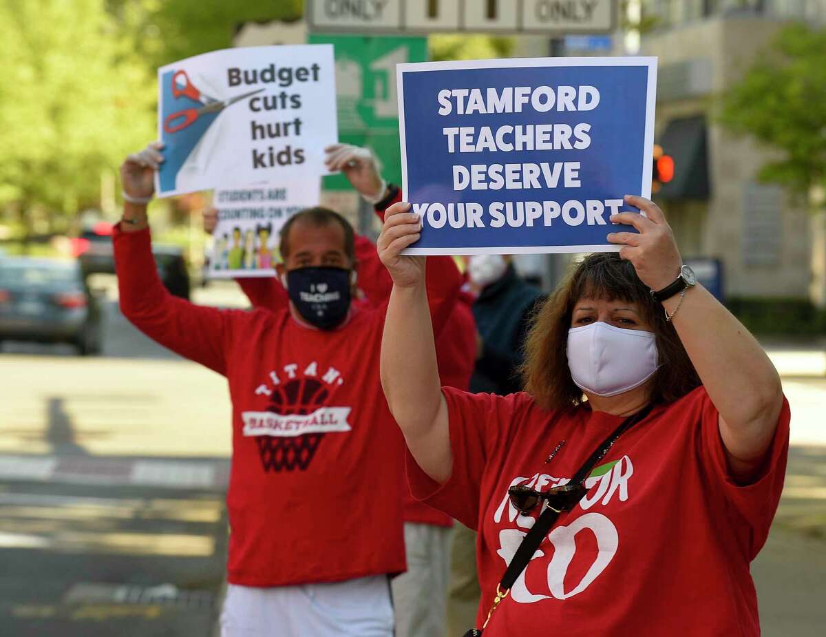 Students, teachers, parents, and other community members hold a rolling rally caravan around the Stamford Government Center on May 21, 2020.