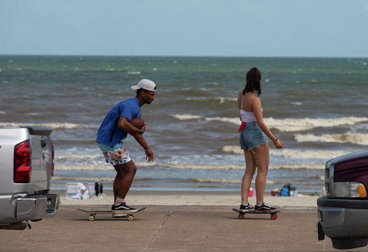 People take advantage of the good weather and skateboard down the Seawall Boulevard Thursday, May 21, 2020, in Galveston.