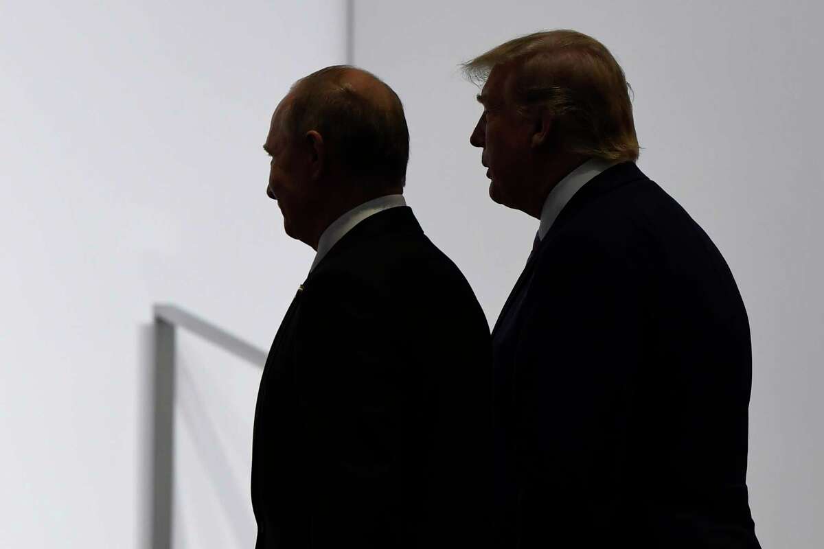 FILE - In this June 28, 2019, file photo, President Donald Trump and Russian President Vladimir Putin walk to participate in a group photo at the G20 summit in Osaka, Japan. The Trump administration is notifying international partners that it is pulling out of a treaty that permits 30-plus nations to conduct unarmed, observation flights over each otheras territory a?” overflights set up decades ago to promote trust and avert conflict. The administration says it wants out of the Open Skies Treaty because Russia is violating the pact and imagery collected during the flights can be obtained quickly at less cost from U.S. or commercial satellites. (AP Photo/Susan Walsh, File)