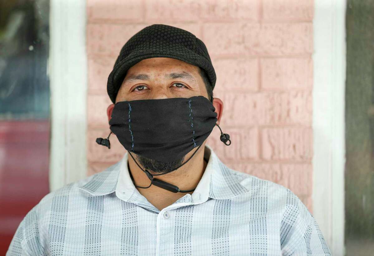 Roy Acosta poses while wearing a mask Thursday, May 21, 2020, along 19th Street in the Heights neighborhood in Houston. He said his daughter gave him the mask as a gift three weeks ago, and that he has been wearing it ever since.