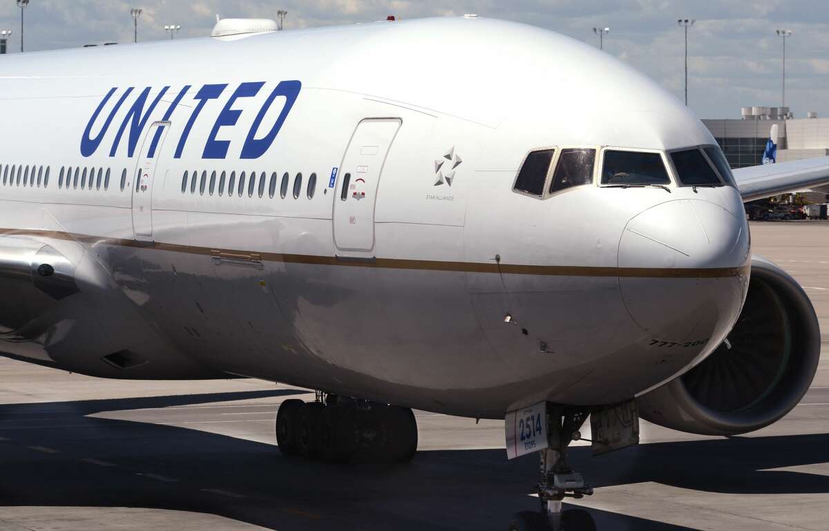 A United Airlines passenger plane taxis at the airport.