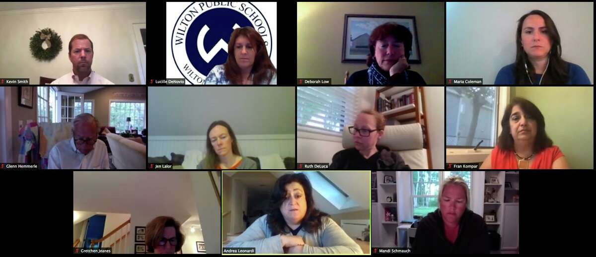 Andrea Leonardi speaks during the Board of Education meeting on May 21. Top row, from left, Superintendent of Schools Kevin Smith, Assistant to the Superintendent Lucille DeNovio, board Chair Deborah Low, Human Resources Director Maria Coleman. Second row, from left, Vice Chair Glenn Hemmerle, board members Jen Lalor and Ruth DeLuca, Director of Digital Learning Fran Kompar. Third row, from left, board member Gretchen Jeanes, Leonardi, board member Mandi Schmauch.
