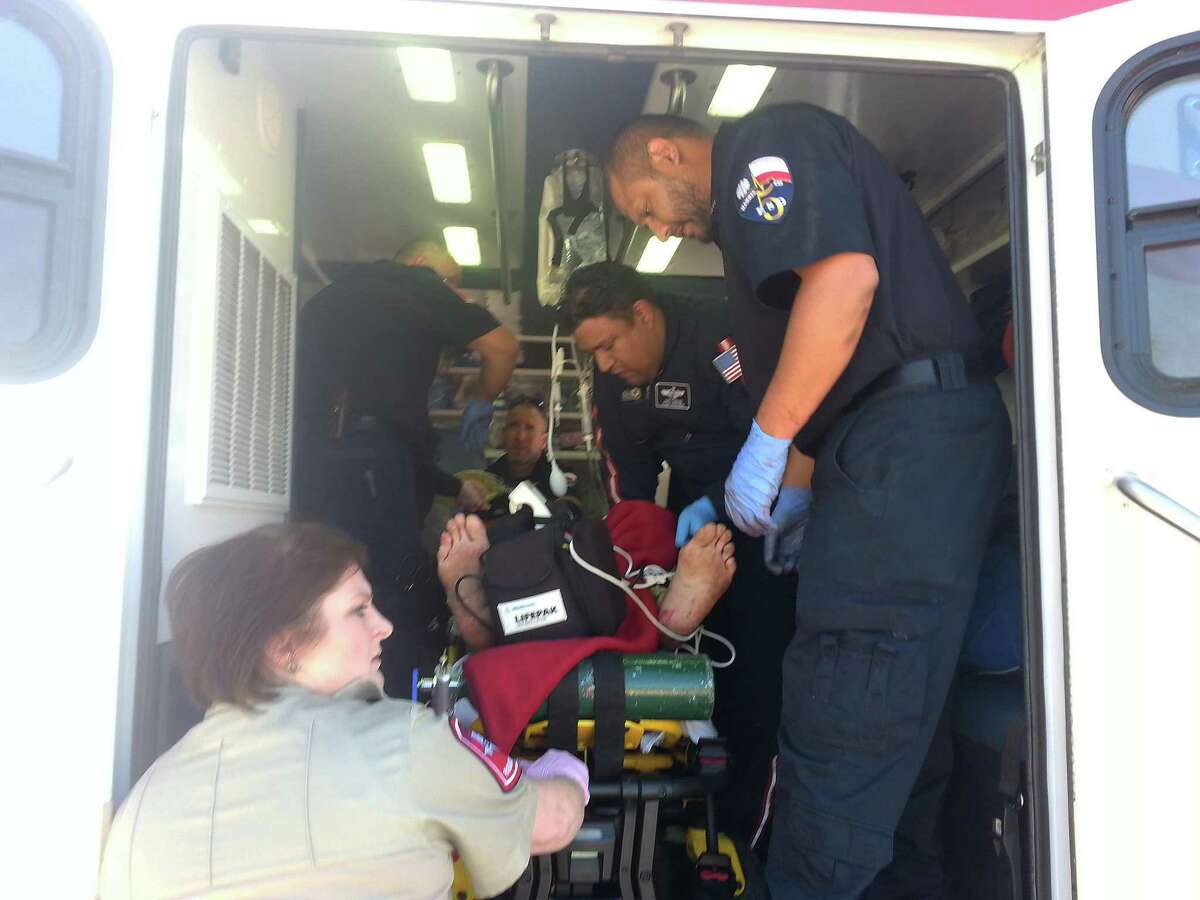 Harris County ESD 5 Director of Operations Christy Graves assists paramedics package a patient for transfer by ground to a nearby hospital.