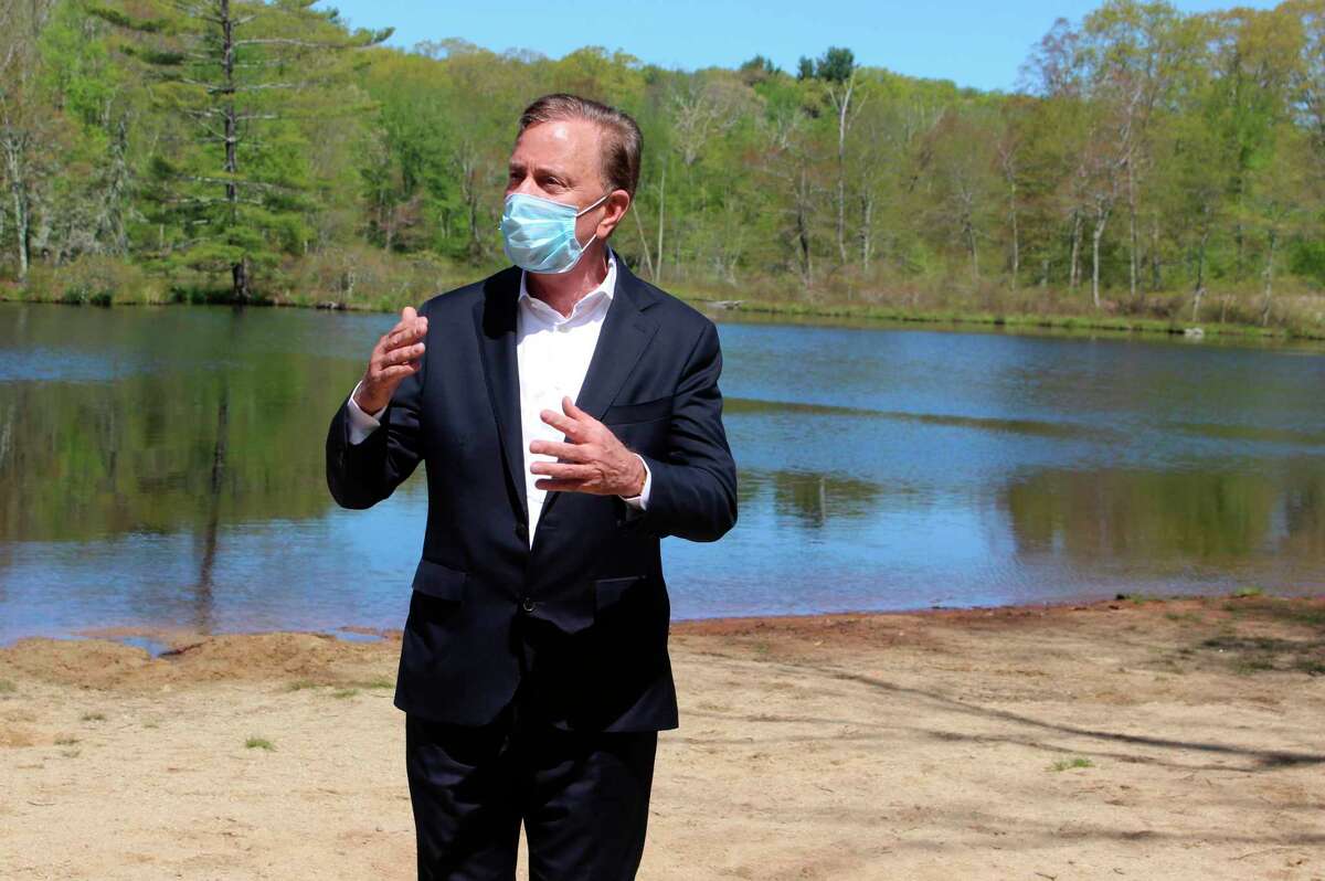 Gov. Ned Lamont, shown here in a 2020 file photo, announced Friday that after a record number of visitors to state parks and forests last year, capacity limits will rise, picnic tables will be allowed and freshwater swimming will resume in places such as Indian Well State Park in Shelton and Squantz Pond in New Fairfield.