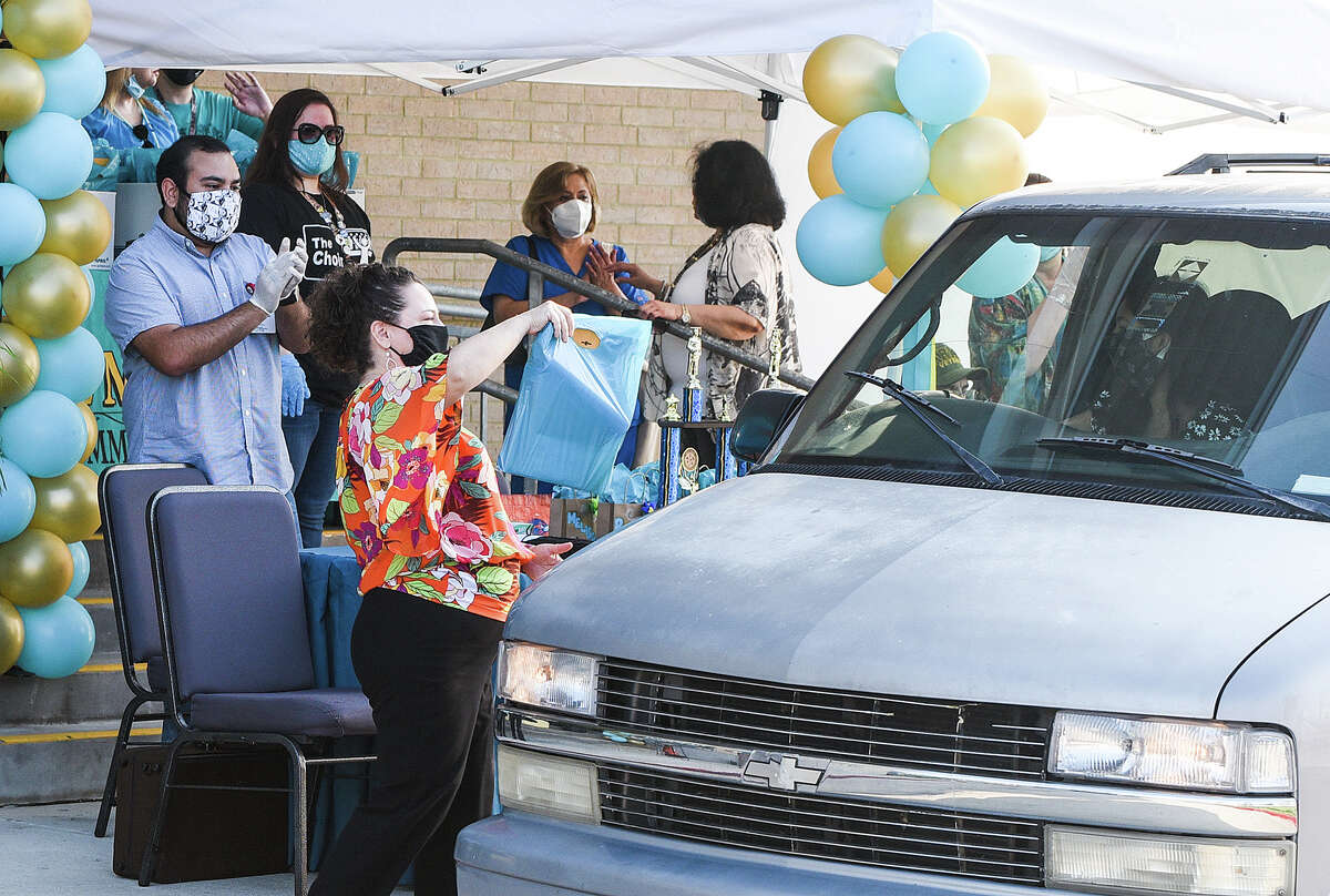 Vidal M. Trevino School of Communication and Fine Arts faculty pass out medals to LISD graduates, Friday, May 22, 2020, during the Curbside Medallion Event.