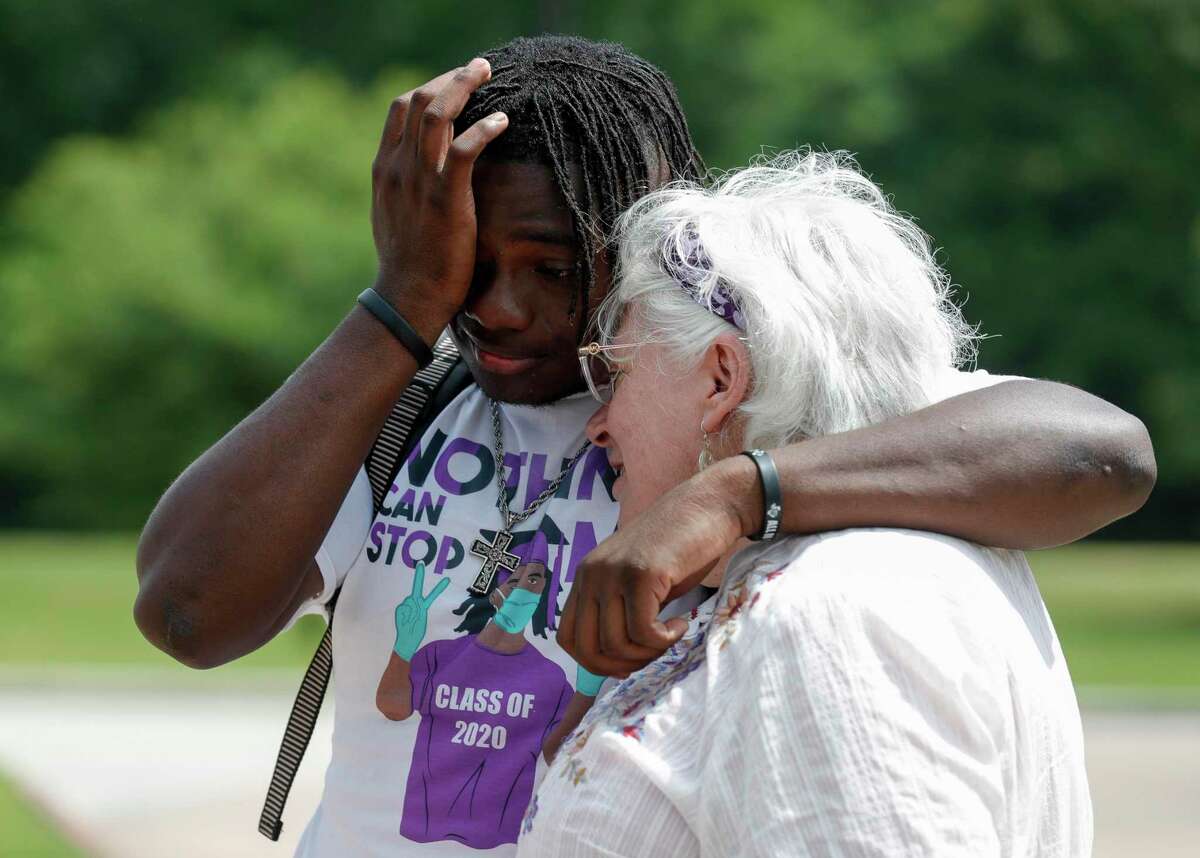 Jaquez Williams wipes tears from his face as he becomes emotional while visiting former teacher Cyn Marlowe at A.R. Turner Elementary School, Friday, May 22, 2020, in Willis.