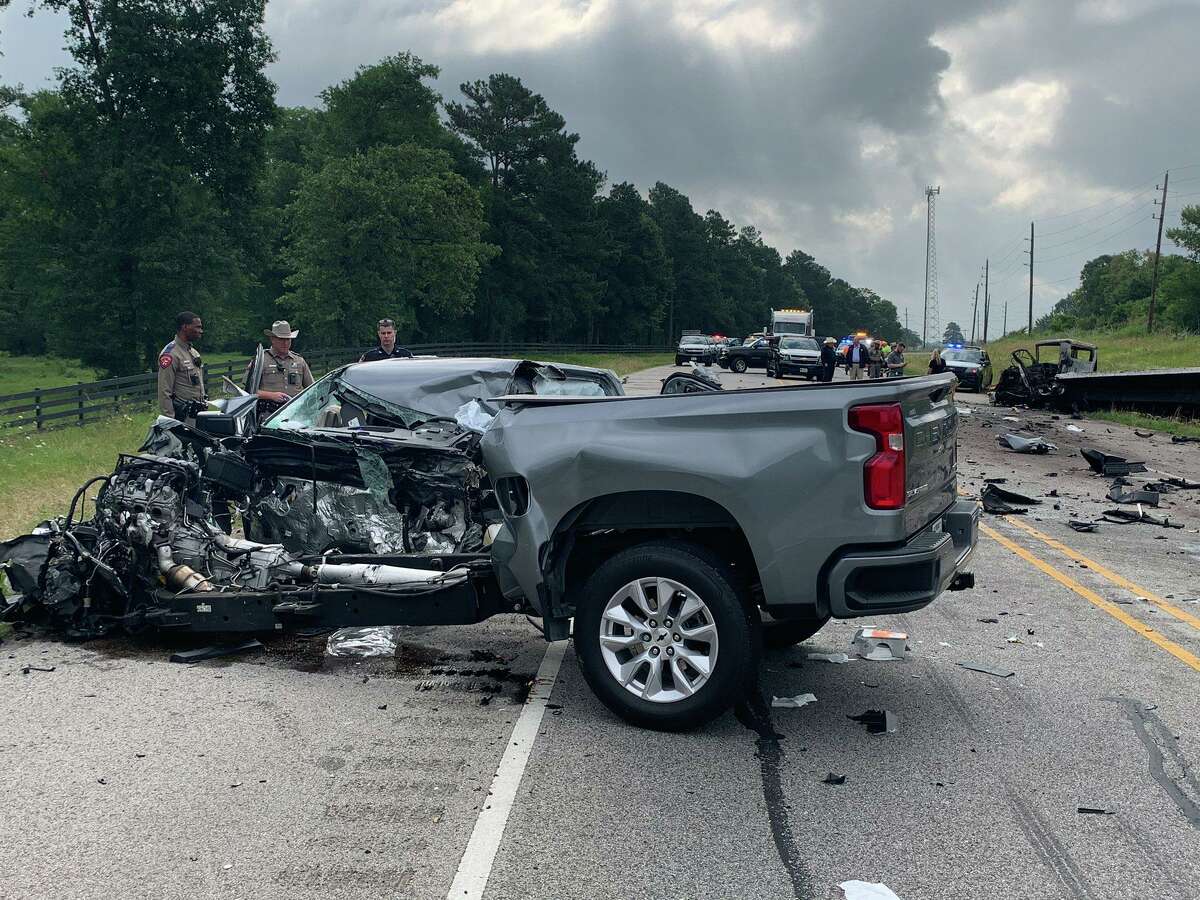 A pickup truck is seen Wednesday morning on Texas 105 in the city of Montgomery after it and a tractor-trailer crashed head-on.