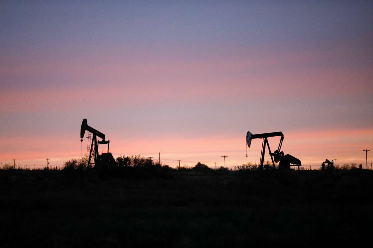 Pumpjacks at sunset photographed near Loving, New Mexico, in the Permian Basin. 