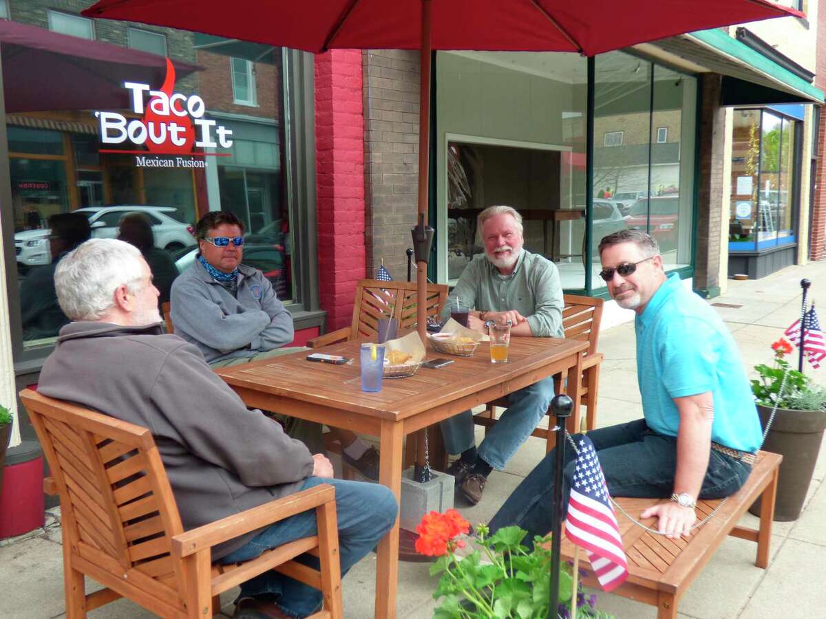 (From left) Manistee City Manager Thad Taylor, Kevin Hughes, Rep. Jack O'Malley and Manistee County commissioner Jeff Dontz enjoy lunch out at Taco 'Bout It in Manistee, which reopened for dine-in patrons Friday. (Scott Fraley/News Advocate)