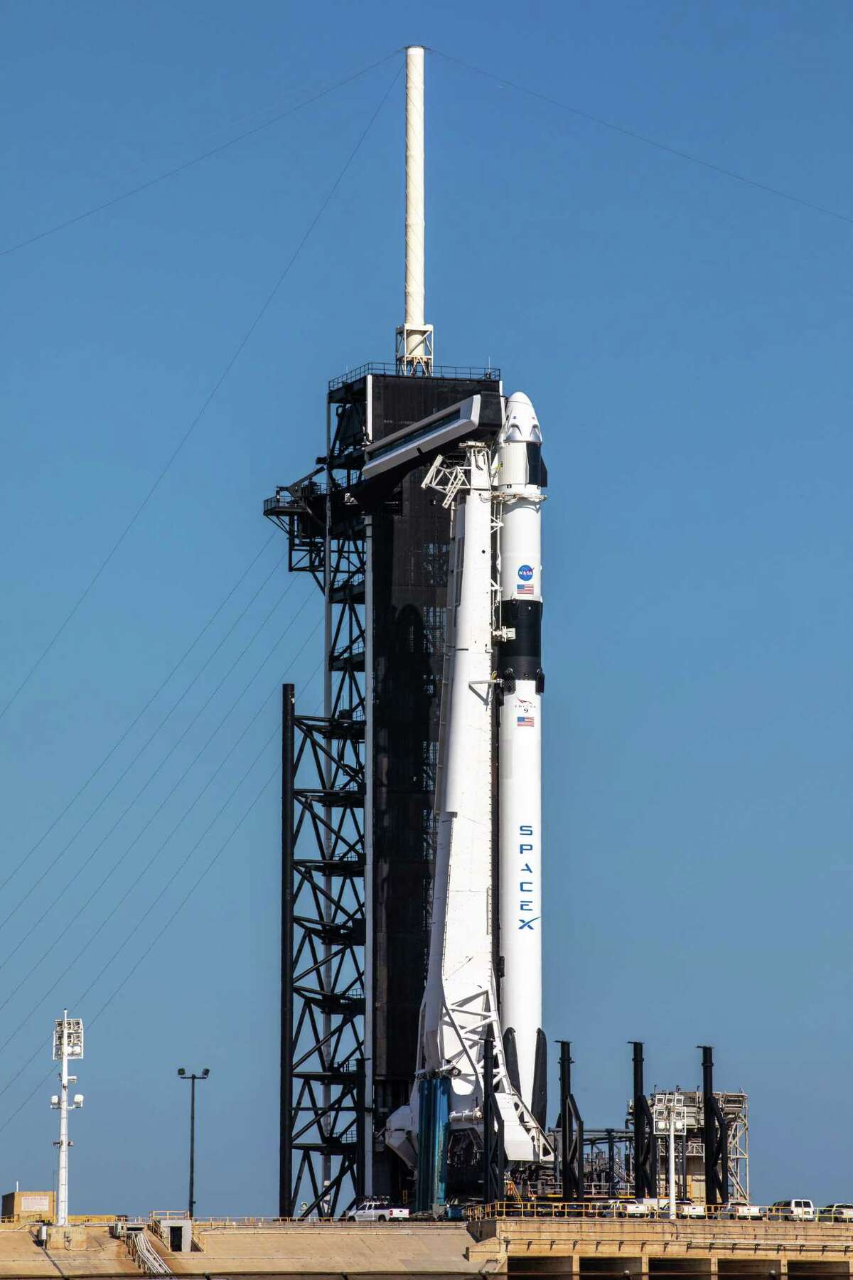 A SpaceX Falcon 9 rocket, with the Crew Dragon spacecraft atop, stands poised for launch at Launch Complex 39A at NASA’s Kennedy Space Center in Florida on May 21, 2020, ahead of NASA and SpaceX's Demo-2 mission. The rocket and spacecraft will carry NASA astronauts Bob Behnken and Doug Hurley to the International Space Station as part of the agency’s Commercial Crew Program. Launch is slated for 3:33 p.m. CDT on Wednesday, May 27.