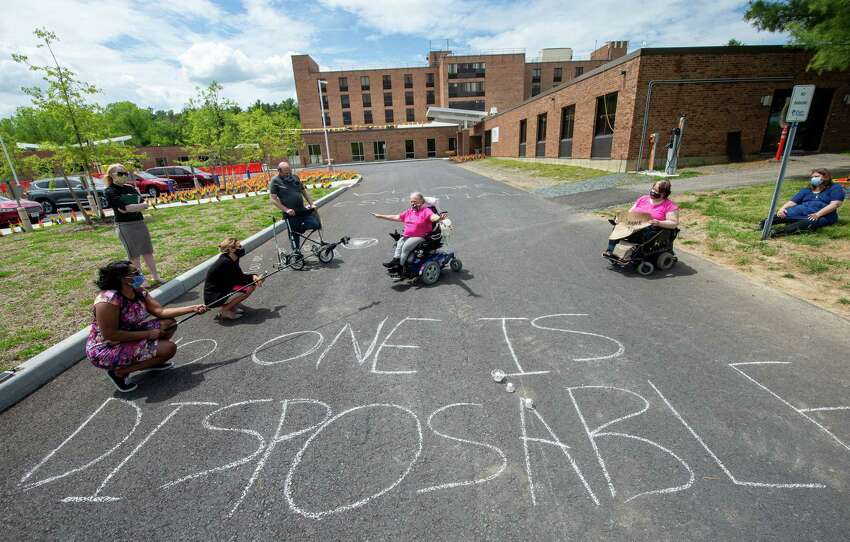 Jamie Farrar, of ADAPT Capital Region, speaks during a vigil at Shaker Place Rehabilitation and Nursing in Colonie NY on Saturday, May 23, 2020 calling on New York state to support nursing home workers, transfer residents who so choose to safer settings and step up state regulations of nursing homes (Jim Franco/Special to the Times Union.)