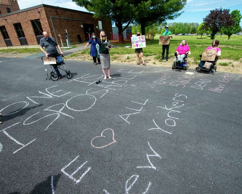 Katy Carroll, of ADAPT Capital Region, speaks during a vigil at Shaker Place Rehabilitation and Nursing in Colonie NY on Saturday, May 23, 2020 calling on New York state to support nursing home workers, transfer residents who so choose to safer settings and step up state regulations of nursing homes (Jim Franco/Special to the Times Union.)
