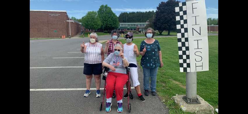 Janet Aldous, 87, of Greenwich completed the virtual Freihofer's Run for Women in 51 minutes on May 23, 2020, pushed by, from left, her daughters Theresa Aldous, Gina Snell, Ingrid Darling and Katie Cosey. (Courtesy photo)