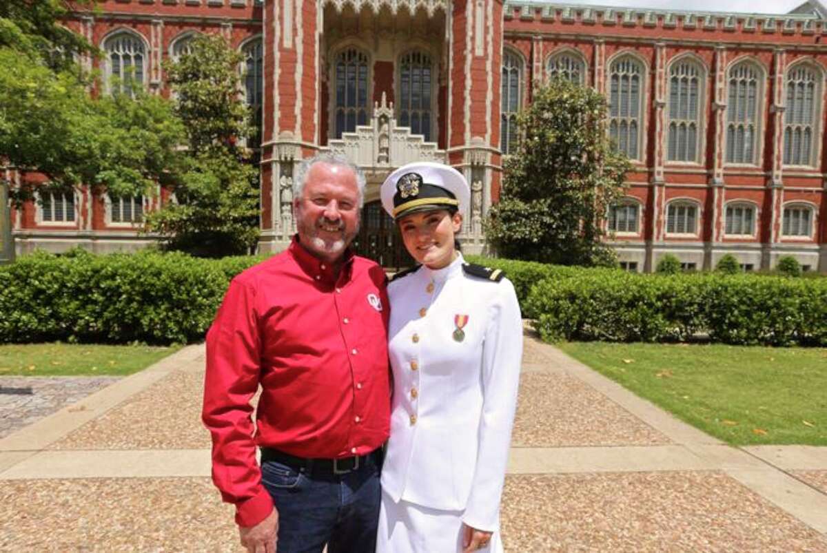 Savanah Pipkin, a former Bethel High School student, with her dad, Gary Pipkin, on the University of Oklahoma campus after she was commissioned as an officer in the Navy. Pipkin is one of nine former Bethel Navy Junior ROTC students who are becoming officers this year.