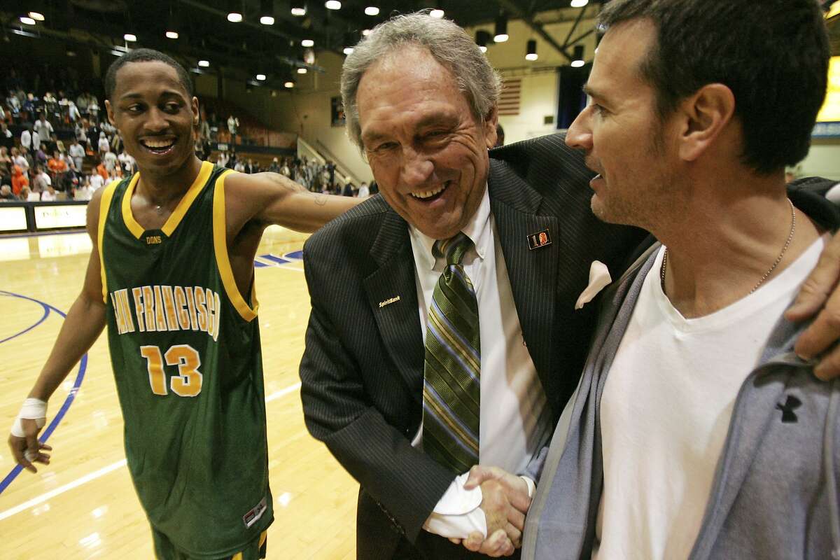 FILE - In this Saturday, Feb. 2, 2008, file photo, San Francisco head coach Eddie Sutton shakes the hand of Terry Anzaldo as Myron Strong, left, smiles after San Francisco defeats Pepperdine 88-85 in an NCAA college basketball game to give Sutton his 800th win, in Malibu, Calif. Sutton, the Hall of Fame basketball coach who led three teams to the Final Four and was the first coach to take four schools to the NCAA Tournament, died Saturday, May 23, 2020. He was 84. (AP Photo/Jeff Lewis, File)