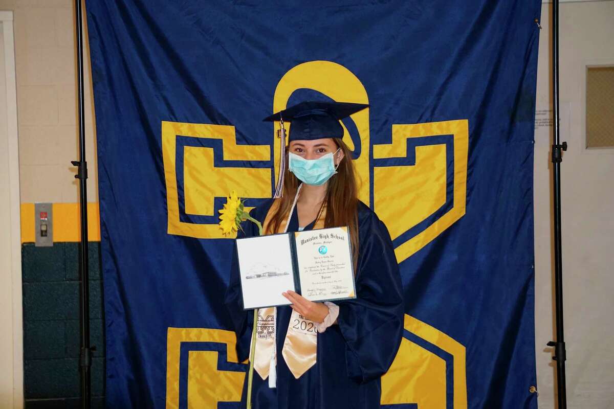 Graduating senior Haley Garcia stands for a photo at Manistee High School after receiving her diploma Saturday. (Courtesy photo)