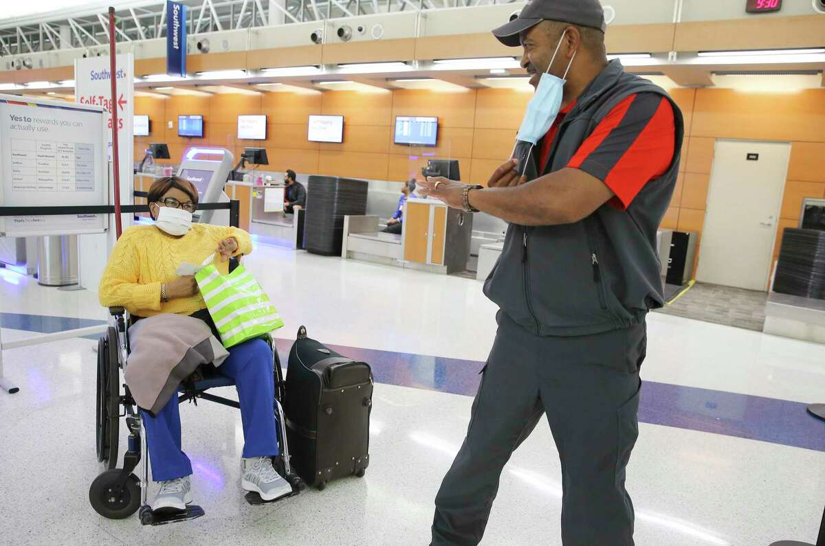 For more than 20 years Skycap Herb Watts, nicknamed “Herb on the Curb,” has brightened many passengers’ day with a smile as he hefted their luggage for their flights on Southwest Airlines. On Thursday, May 7, 2020, Watts momentarily takes down his mask to bid farewell to an elderly passenger named Mrs. Williams (did not want to give her first name) after helping with her bags and boarding passes for her flight.