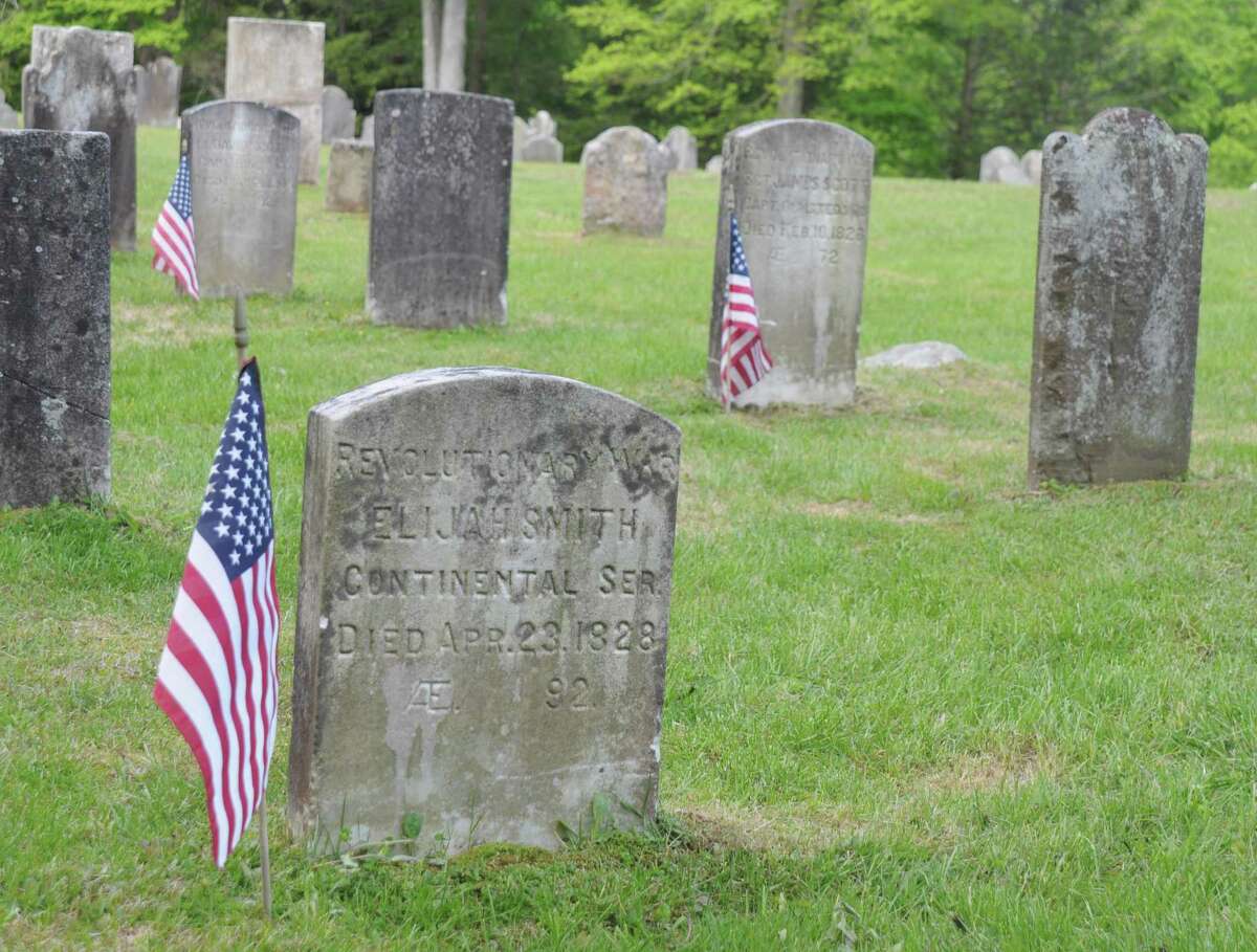 The car parade will stop for a moment of remembrance at St, Mary's Cemetery, where the graves of veterans are marked with small American Flags.
