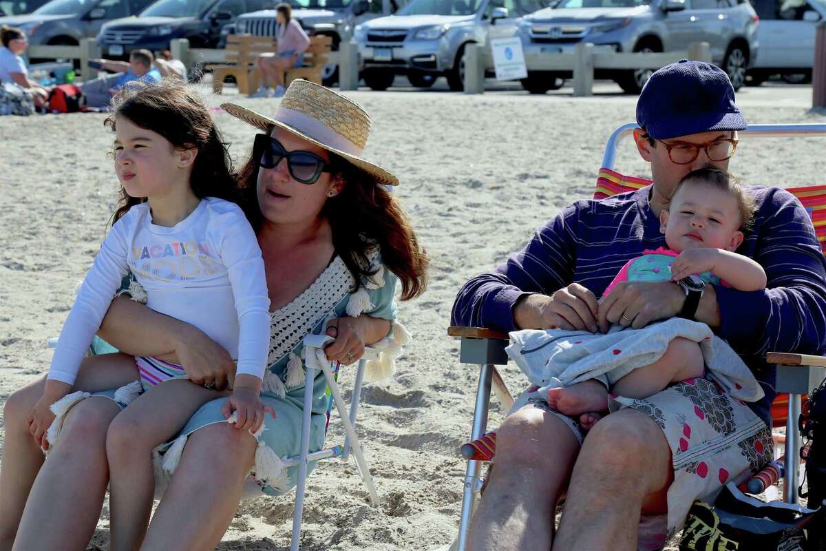 The Brunwasser family of Westport enjoy the day at Compo Beach on Sunday, May 24, 2020, in Westport, Conn.