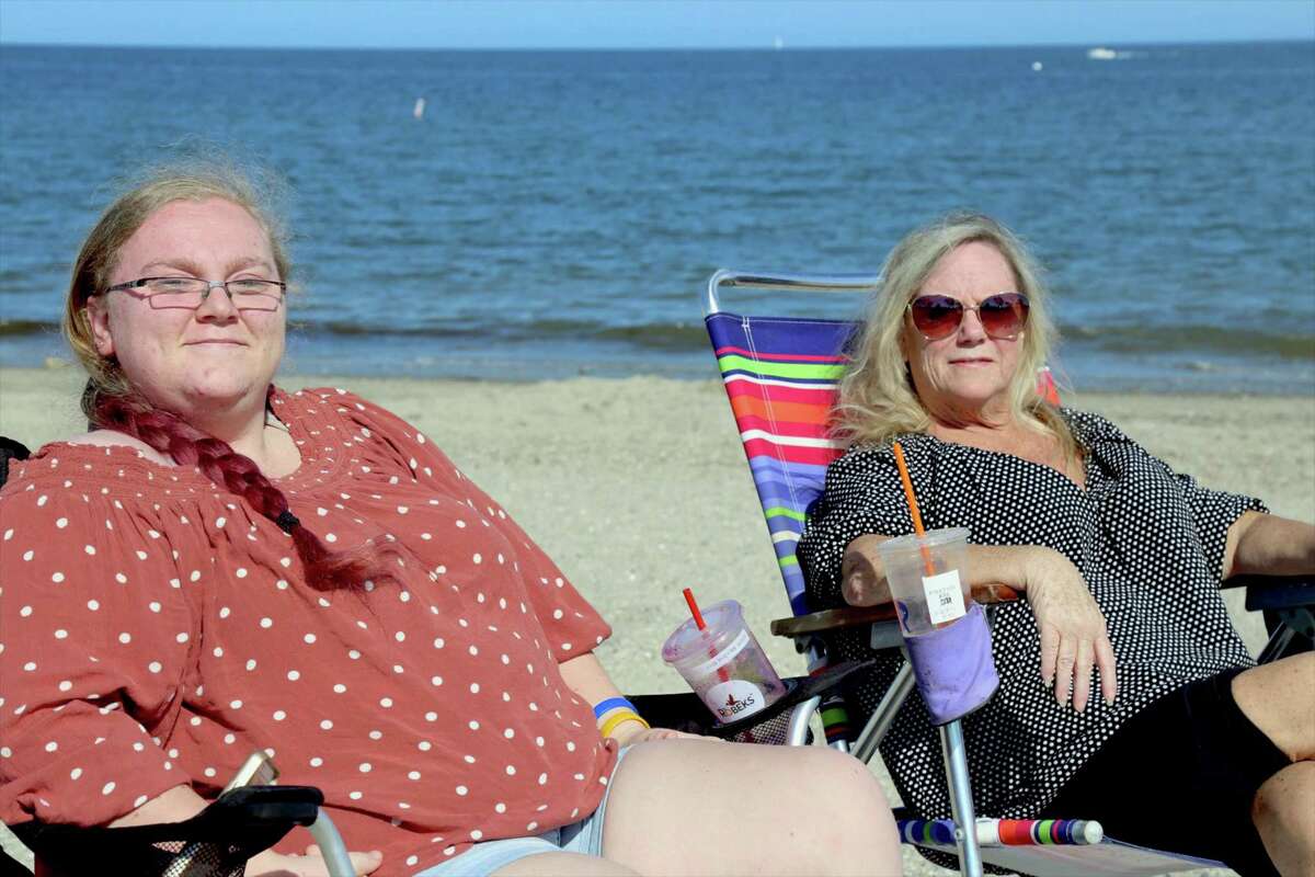 Emily Flood of Westport and her mom, Tracy, take in some sun at Compo Beach on Sunday, May 24, 2020, in Westport, Conn.