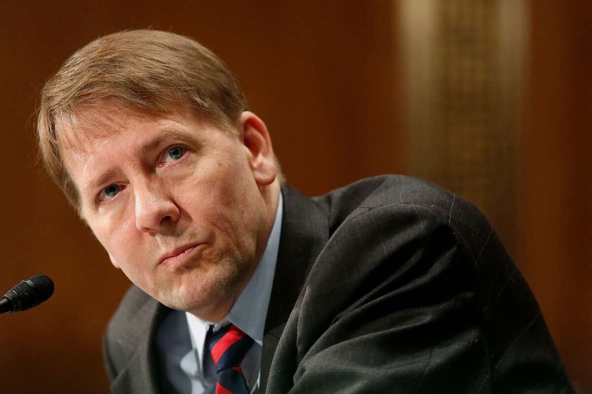 U.S. Consumer Financial Protection Bureau (CFPB) Director Richard Cordray testifies before a Senate Banking Committee hearing on Capitol Hill in Washington June 10, 2014. REUTERS/Jonathan Ernst (UNITED STATES - Tags: POLITICS BUSINESS)