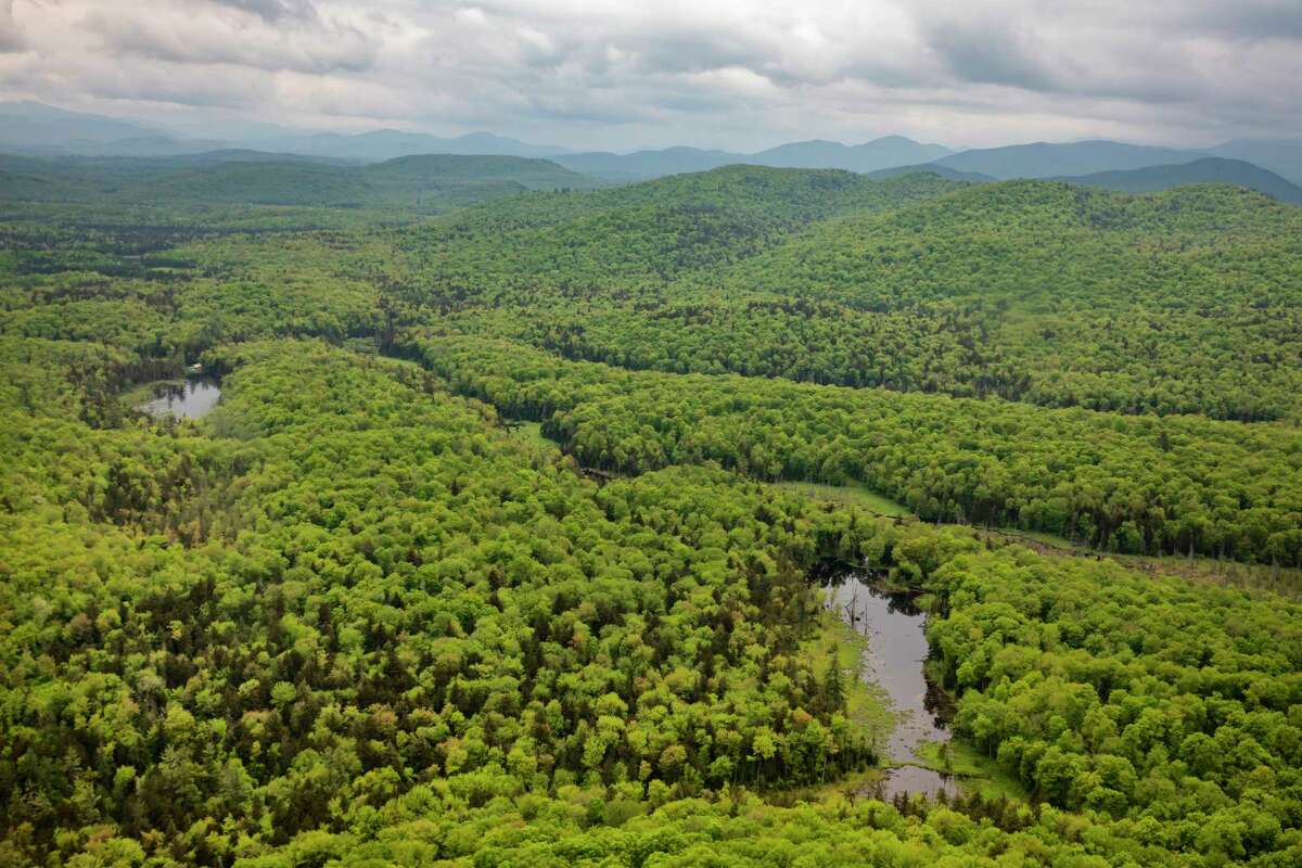 The view from above of the vast Adirondack Park, N.Y. on May 31, 2019. Roughly six million acres comprise the Adirondack state park and some 2.6 million acres of forest preserve contain broad stretches that are open to public recreation. (Tony Cenicola/The New York Times)