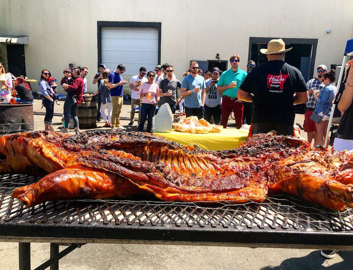 Hoodoo Brown's on Route 7 is roasting a whole pig today and giving "whole hog sandwiches" to those in need, to celebrate the restaurant's fifth anniversary.