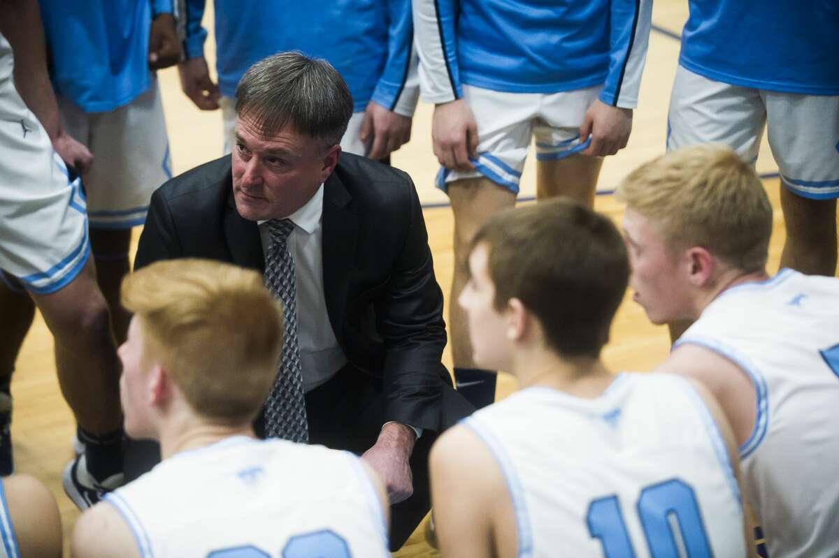 Meridian boys' basketball coach and athletics director Mitch Bohn — seen here during a timeout in a Feb. 5, 2020 game against Beaverton — is part of a work crew which has been helping with Sanford flood clean-up efforts the past several days.