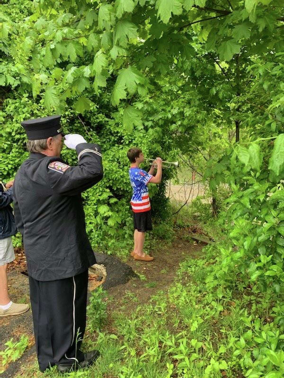 On Memorial Day, May 25, three Trumbull High School Golden Eagles Marching Band (THSGEMB) trumpet players participated in a unique opportunity. Since many Memorial Day celebrations were canceled due to the coronavirus pandemic, the American Legion coordinated TAPS to be played along the Housatonic River beginning at 10 a.m. It was played from the Long Island Sound going North to the Massachusetts state line. Pictured are Sarah Wojtaszek, Derek Ploski (in red/white/blue shirt), and Nick Siwanowicz (in light blue shirt and khakis).
