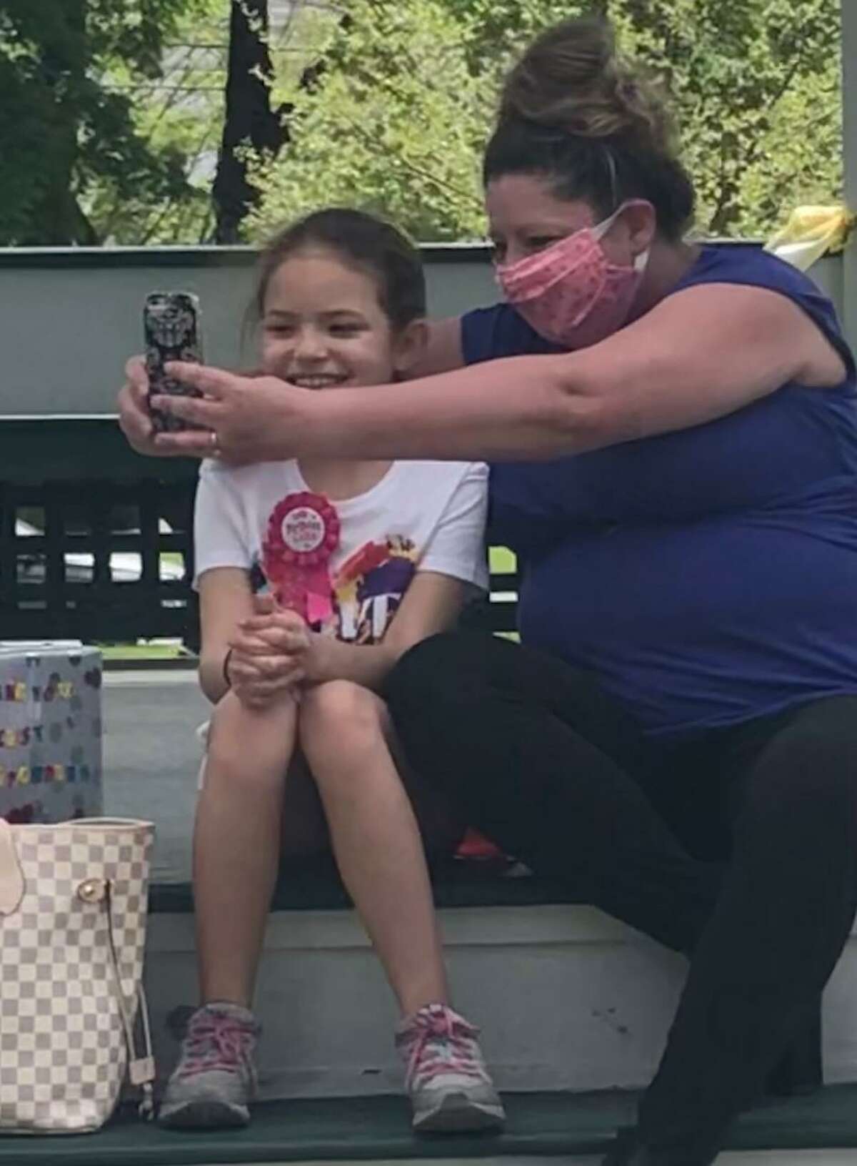 Celebrating a birthday isn't what it used to be these days. Living during a pandemic, when restrictions are in place regarding the amount of people permitted at a gathering and social distancing measures in place, makes it difficult to celebrate a special occasion like a birthday difficult. Lyliana Martinez of New Milford wanted to do something special for her 10th birthday, so she asked family and friends to stop by the Village Green May 17 to say hello and invited people to make a donation to benefit first responders. Her family surprised her with a parade of fire trucks, town trucks and family and friends. Lyliana collected $510 to donate. Above, Lyliana and her grandmother, Darlene Hislop, take a selfie before the festivities begin. May 17, 2020