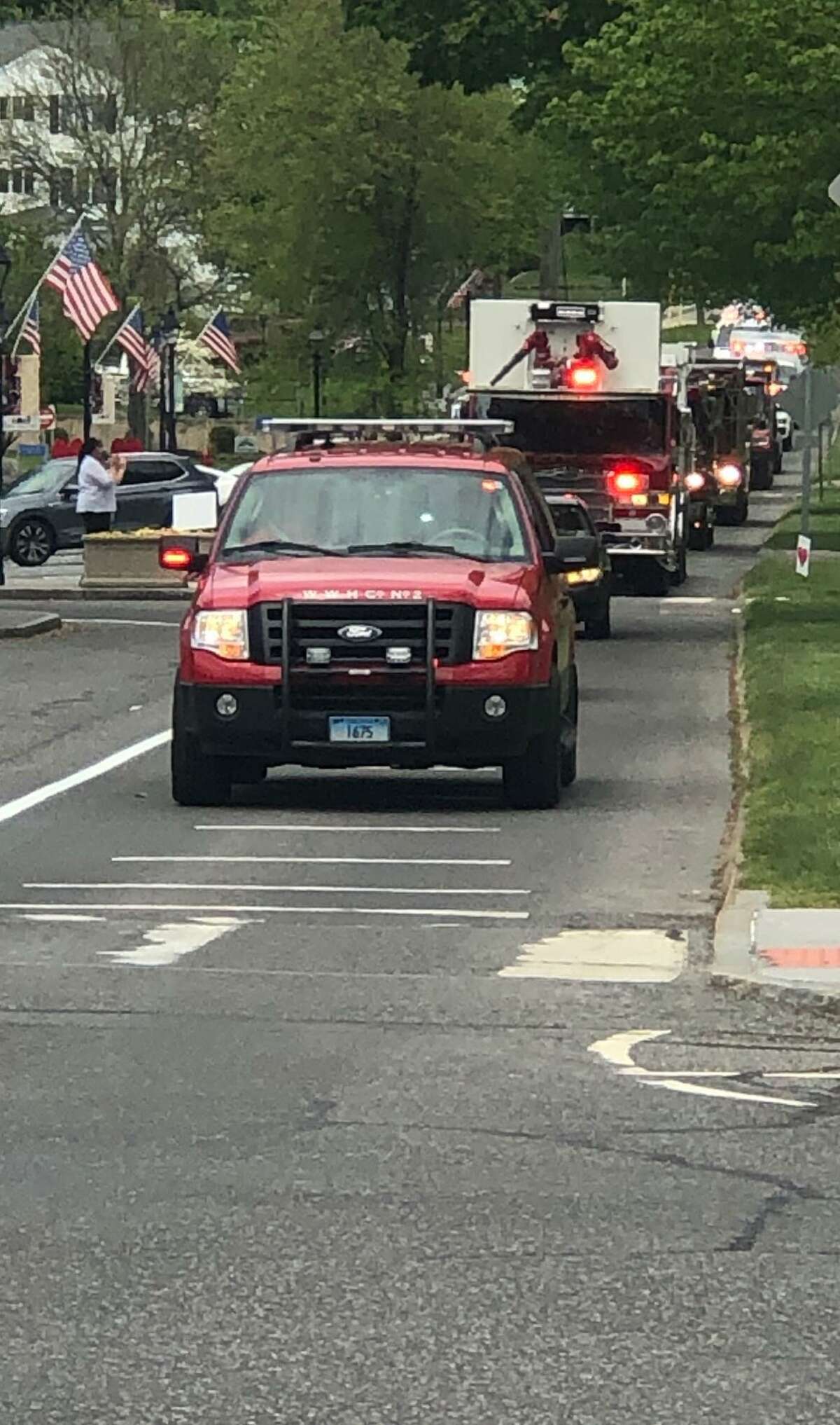 Emergency vehicles lead a birthday parade down Main Street in New Milford for Lyliana Martinez last Sunday.