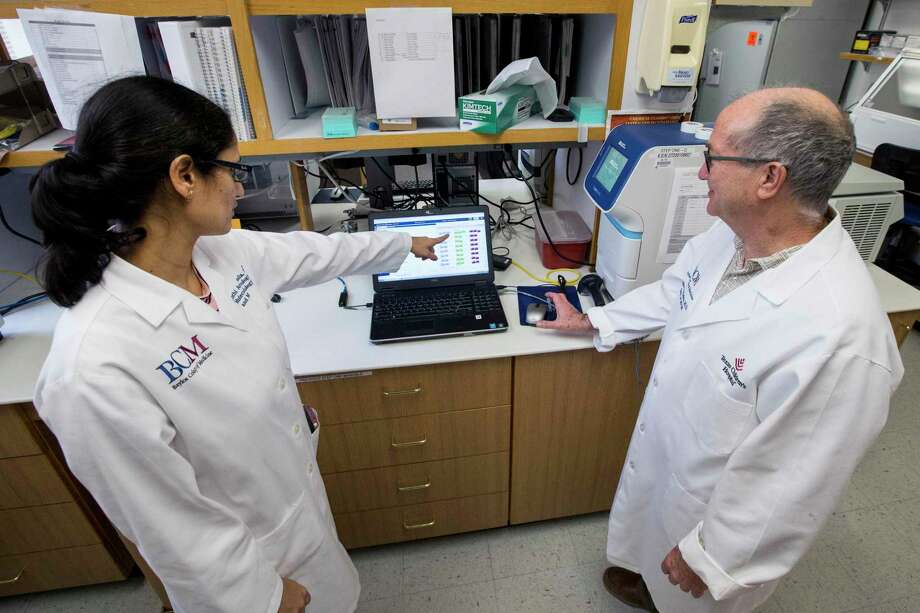 Vasanthi Avadhanula shows Dr. Pedro Piedra lab results from Baylor College of Medicine’s work with antibodies to the coronavirus. Piedra led Baylor’s development of a coronavirus antibody blood test the medical school plans to use to determine the prevalence of the virus in Houston. Photo: Brett Coomer, Houston Chronicle / Staff Photographer / © 2020 Houston Chronicle