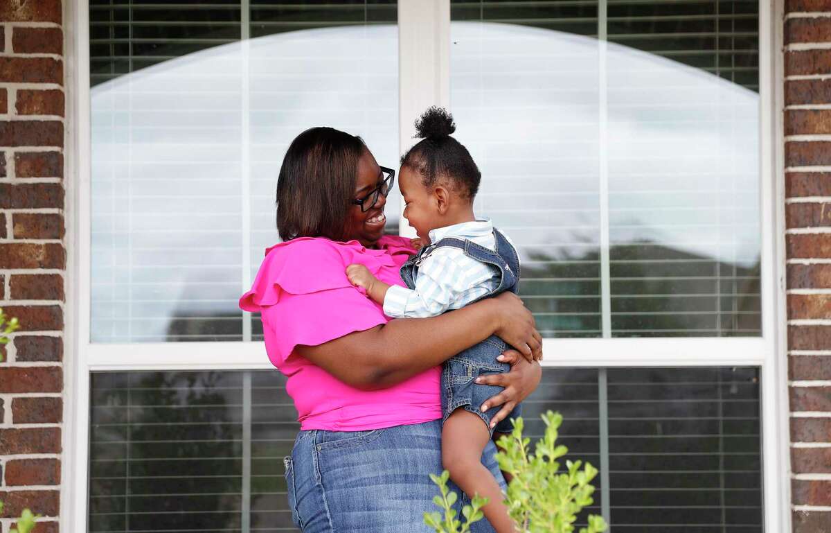 Aisha Atkinson with her two-year-old son, Aries, at home, in Rosenberg, Saturday, May 16, 2020. Aries was born at 23 weeks gestation. He had two massive brain bleeds and spent 150 days in the NICU. He will have chronic hydrocephalus and cerebral palsy his entire life, doctors estimate. Aries is one out of four babies to use a new device called CTOT, which is a wearable imaging device for awake infants with brain disorders. It was made using night-vision goggle technology, near-infrared light and high-resolution detectors. The device (which is a cap with wires) is used so babies don't have to be put under anesthesia which is super risky for them.