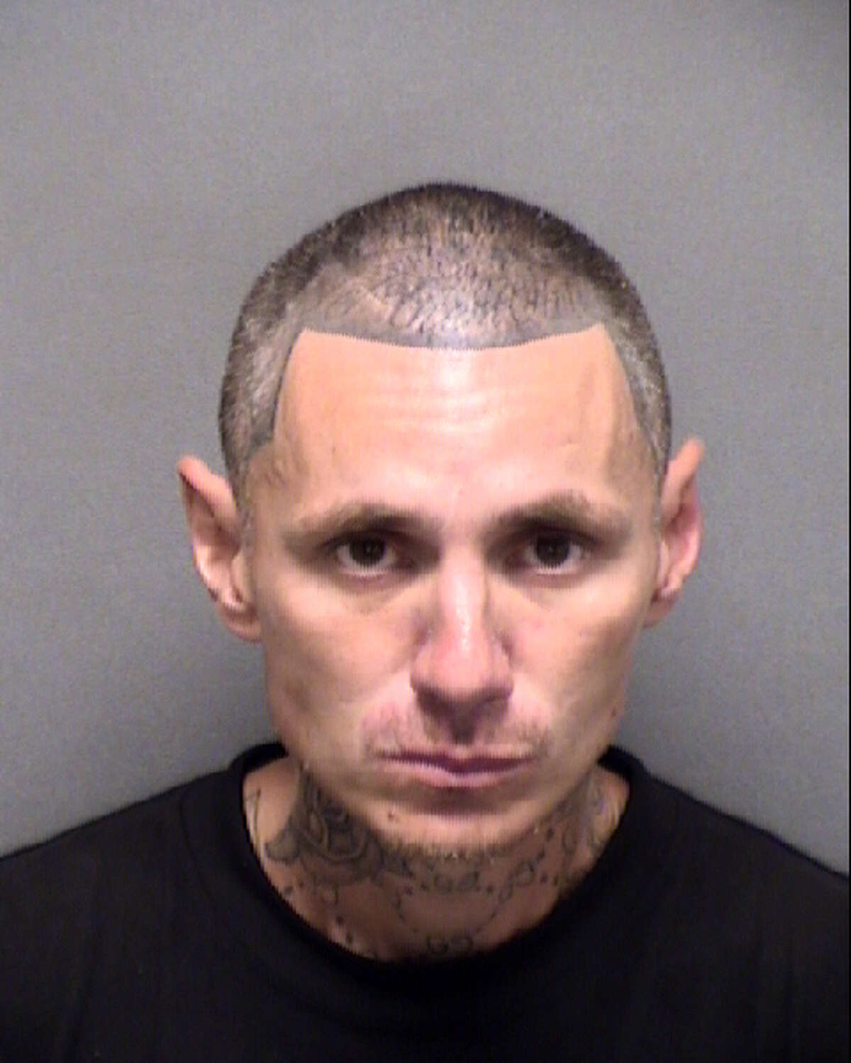 Apolinar Medina, 37,  was arrested after stealing a pair of autographed Tim Duncan sneakers from a North Side store, an arrest affidavit said.