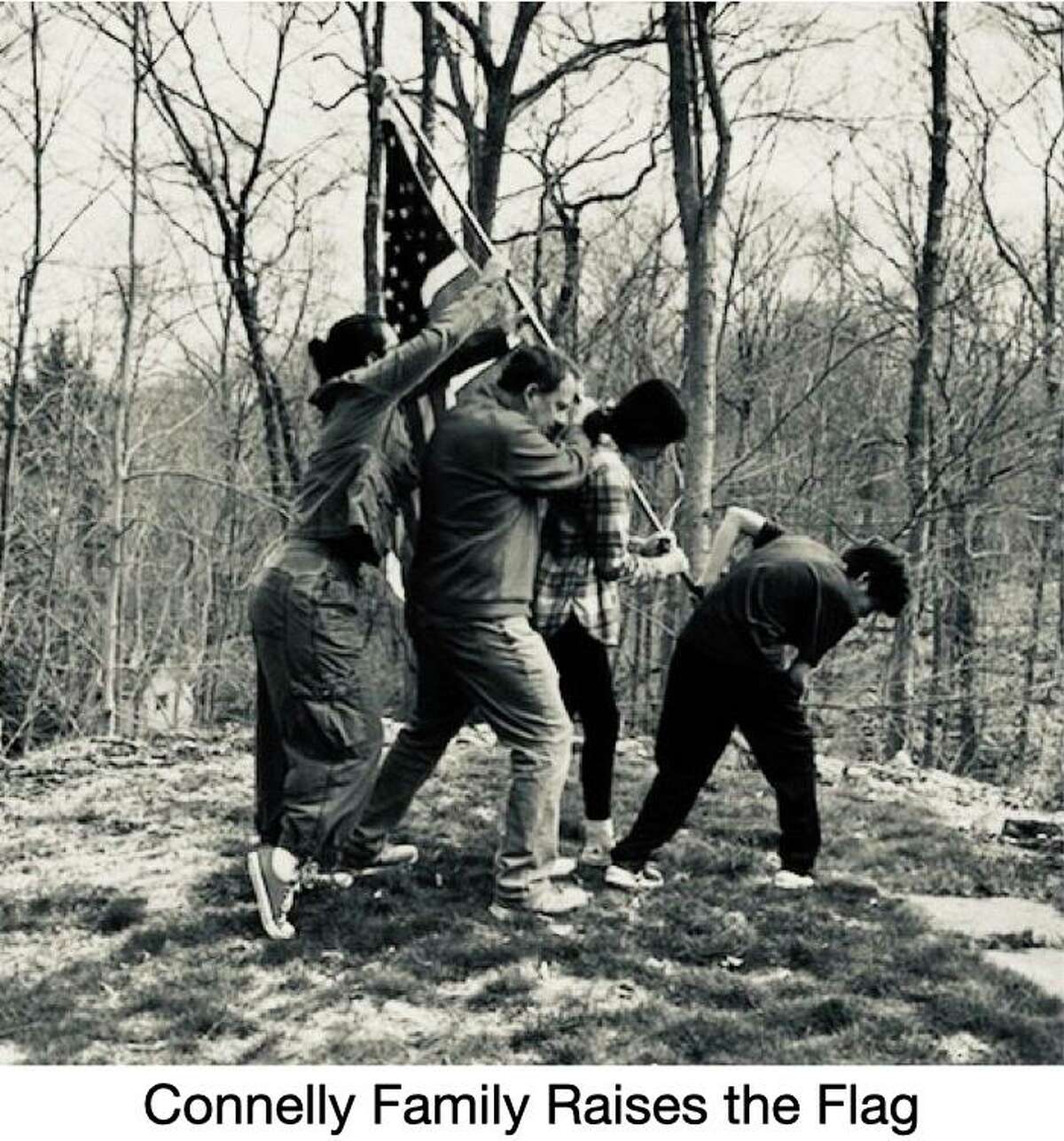 The Connelly family won the Democratic Town Committee's recreated image contest with a re-do of the famous shot of the flag being raised over Iwo Jima during World War II.