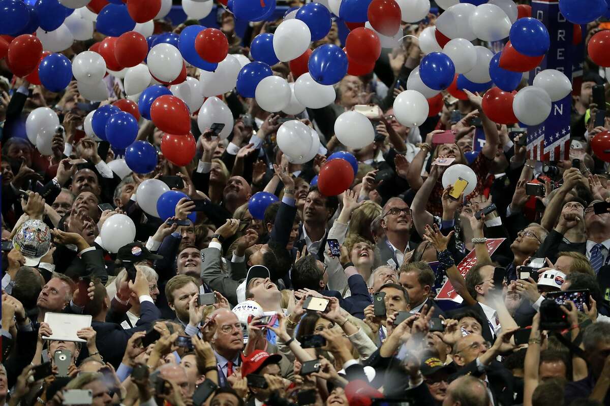 FILE - In this July 21, 2016, file photo, confetti and balloons fall during celebrations after Republican presidential candidate Donald Trump's acceptance speech on the final day of the Republican National Convention in Cleveland. President Donald Trump demanded Monday, May 25, 2020, that North Carolina's Democratic governor sign off “immediately” on allowing the Republican National Convention to move forward in August with full attendance despite the ongoing COVID-19 pandemic. Trump's tweets Monday about the RNC, planned for Charlotte, come just two days after the North Carolina recorded its largest daily increase in positive cases yet. (AP Photo/Matt Rourke, File)