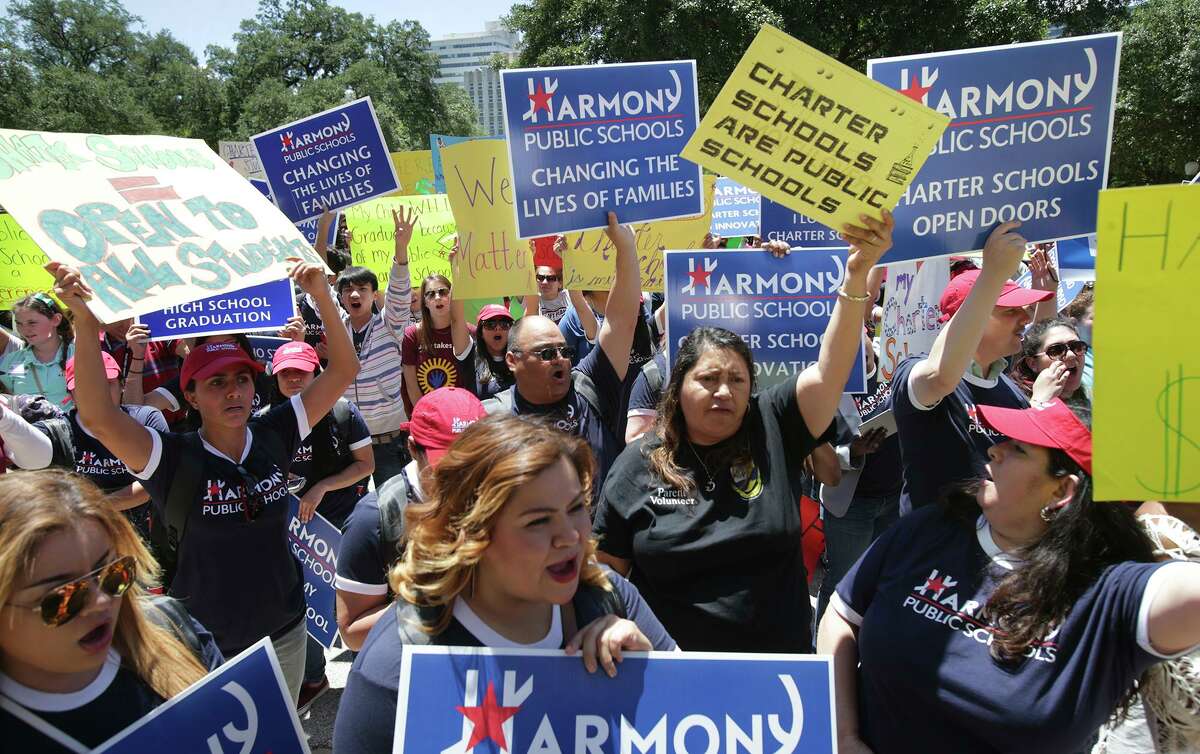 Supporters of charter schools cheer Gov. Greg Abbott during a 2015 rally in Austin. Charter schools have helped improve public education as a whole.
