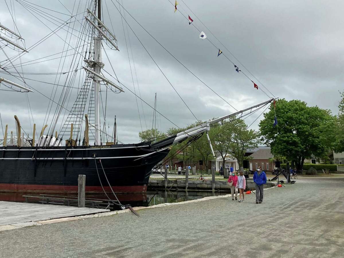 Mystic Seaport Museum was closed for more than two months because of the pandemic, but has finally reopened. Visitors are seen here enjoying the grounds over Memorial Day weekend. Masks are required.