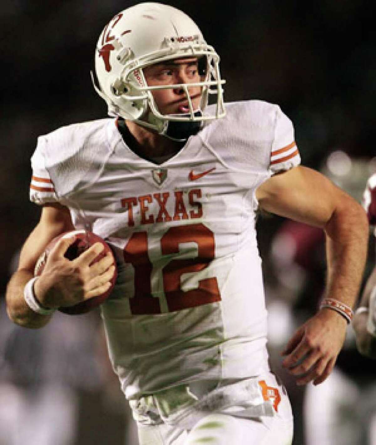 Colt McCoy runs for a touchdown against Texas A&M on Nov. 26.