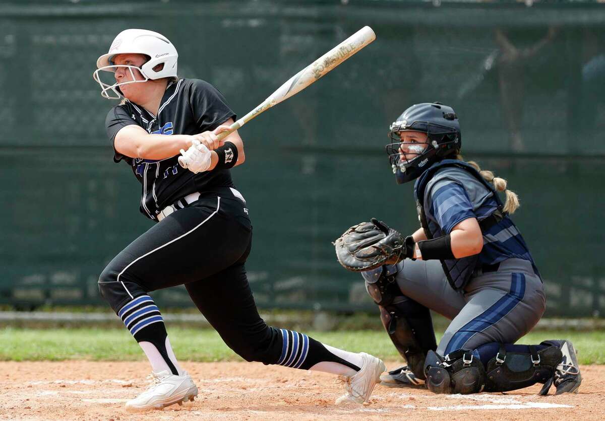 FILE — Morgan Dutton #11 of Oak Ridge connects for a single during the first inning of a District 15-6A high school softball game at College Park High School, Wednesday, March 11, 2020, in The Woodlands.
